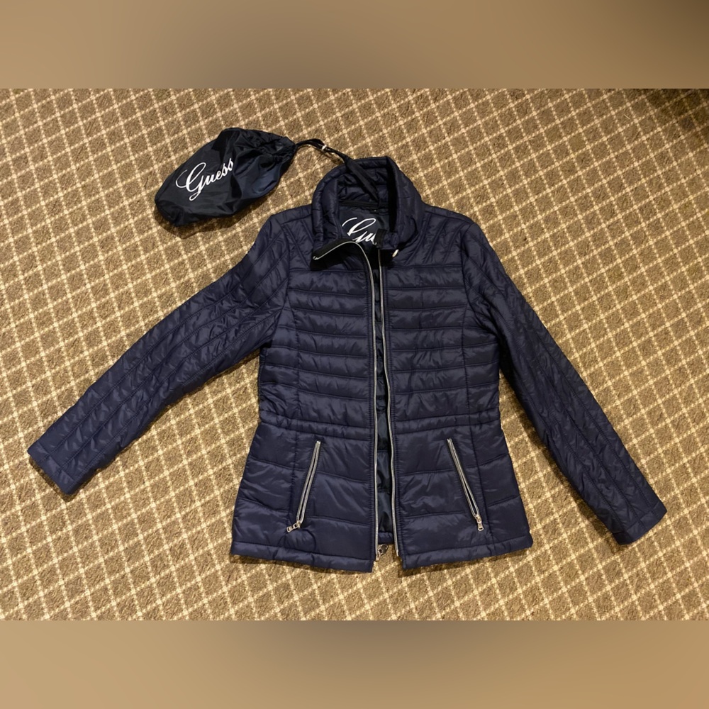Women’s Guess down jacket with fold away bag, size medium. Very soft and warm